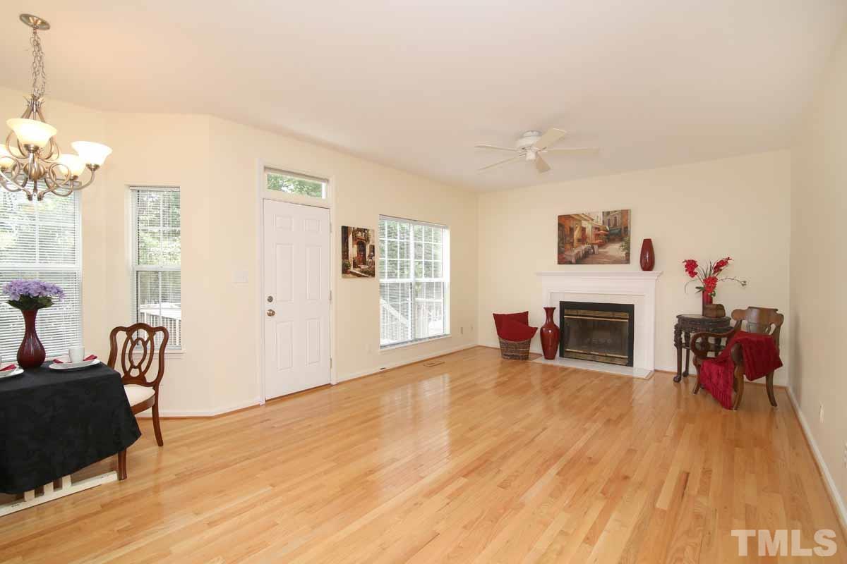2416 Constitution Drive Raleigh, NC 27615 - Photo 7 of 25 a view of a livingroom with a fireplace and dining room