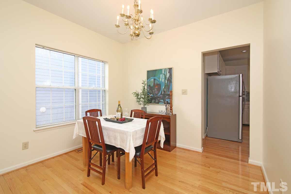 2416 Constitution Drive Raleigh, NC 27615 - Photo 9 of 25 a view of a dining room with furniture window and outside view