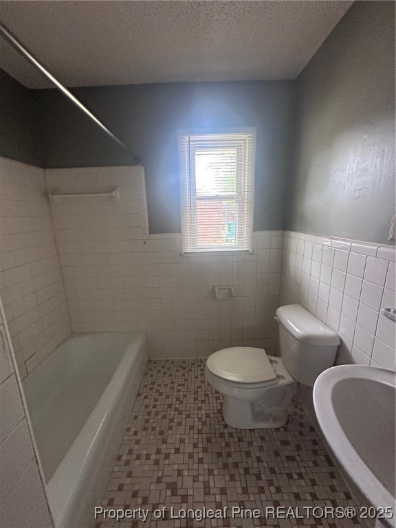 1047 Rulnick Street, Unit C Fayetteville, NC 28304 - Photo 3 of 3 a bathroom with a toilet and a sink