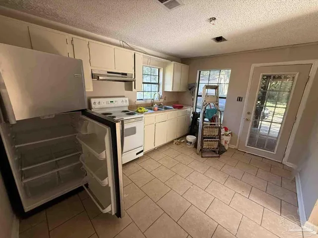 a workspace with furniture and a window