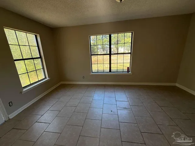 a view of a livingroom with windows