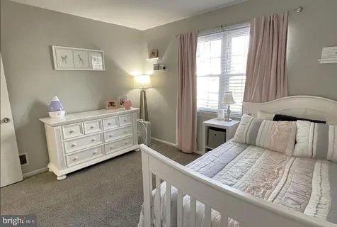 a bed room with a bed and a window