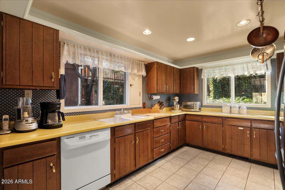 103 North Harding Drive Sedona, AZ 86336 - Photo 17 of 62 a kitchen with a sink and cabinets