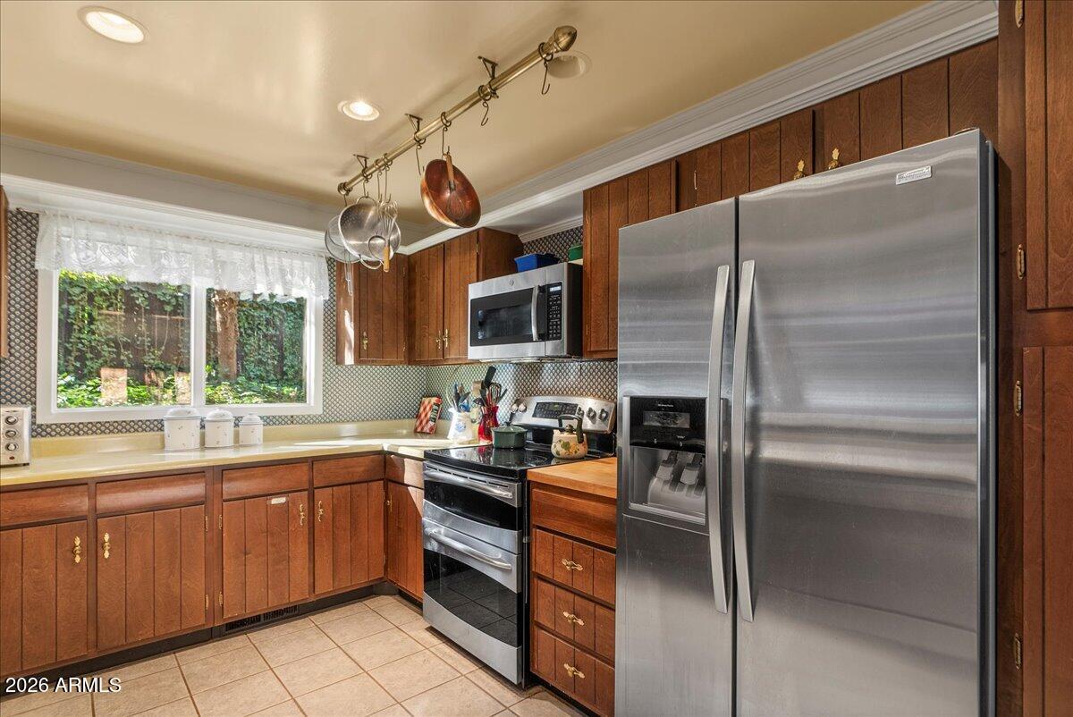 103 North Harding Drive Sedona, AZ 86336 - Photo 19 of 62 a kitchen with a sink stainless steel appliances and cabinets
