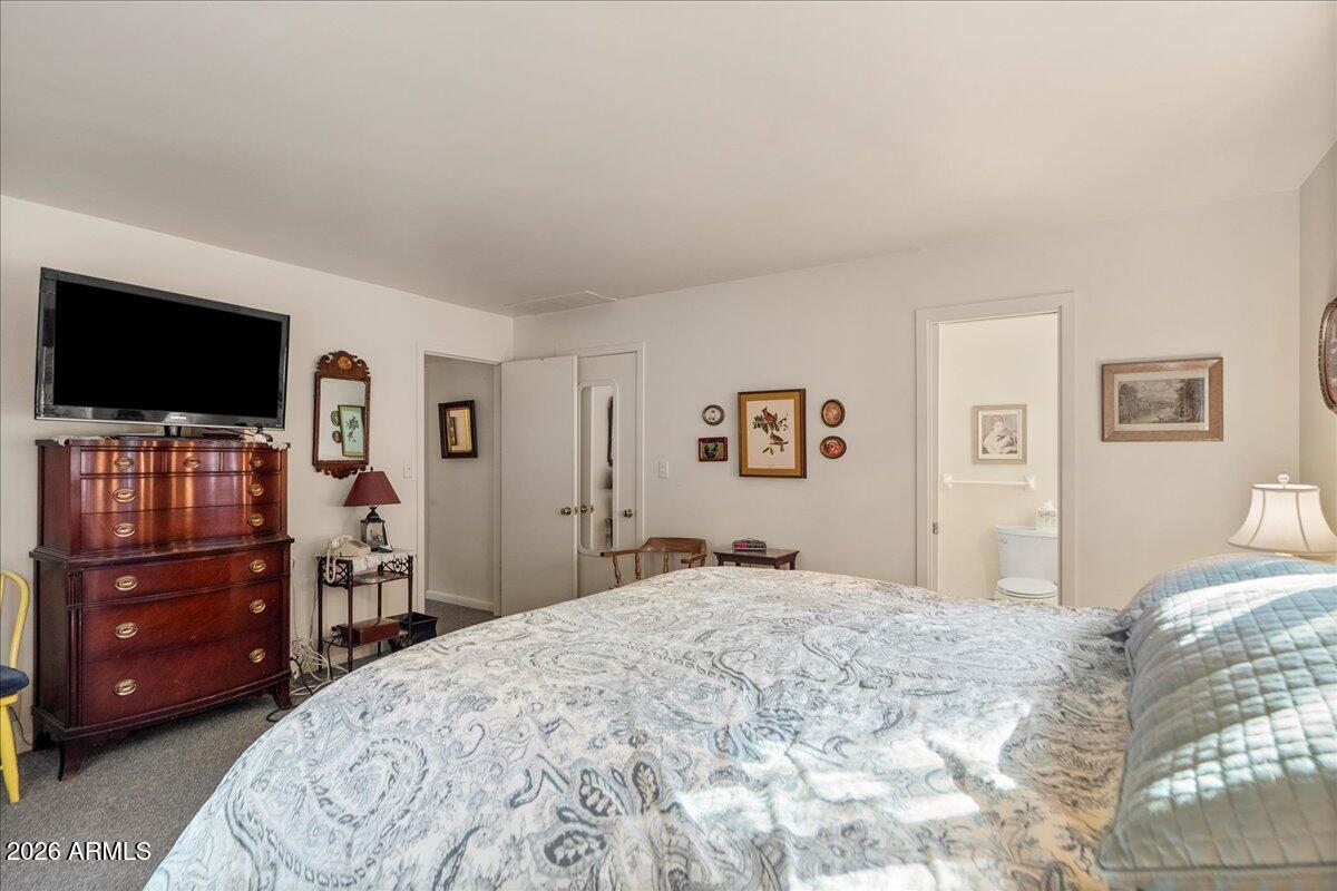 103 North Harding Drive Sedona, AZ 86336 - Photo 22 of 62 a bedroom with a bed and a flat screen tv