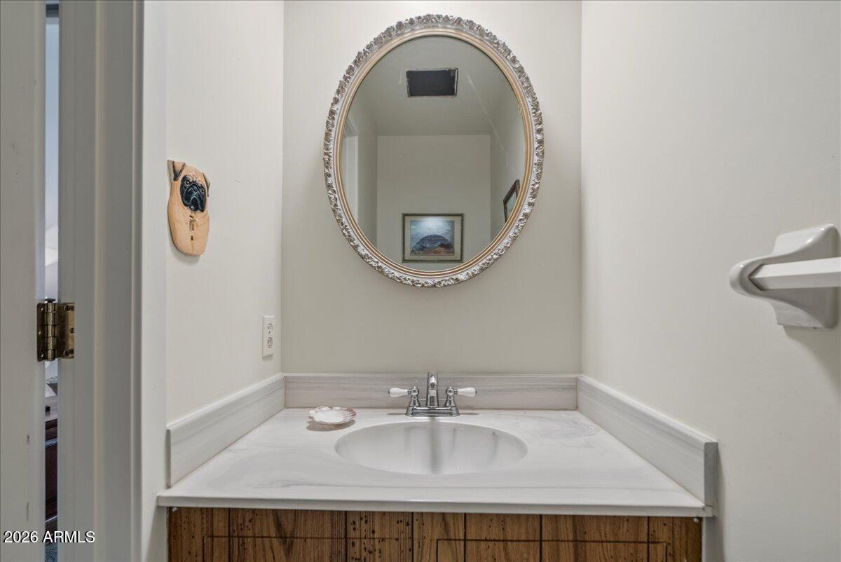 103 North Harding Drive Sedona, AZ 86336 - Photo 25 of 62 a bathroom with a sink and a mirror