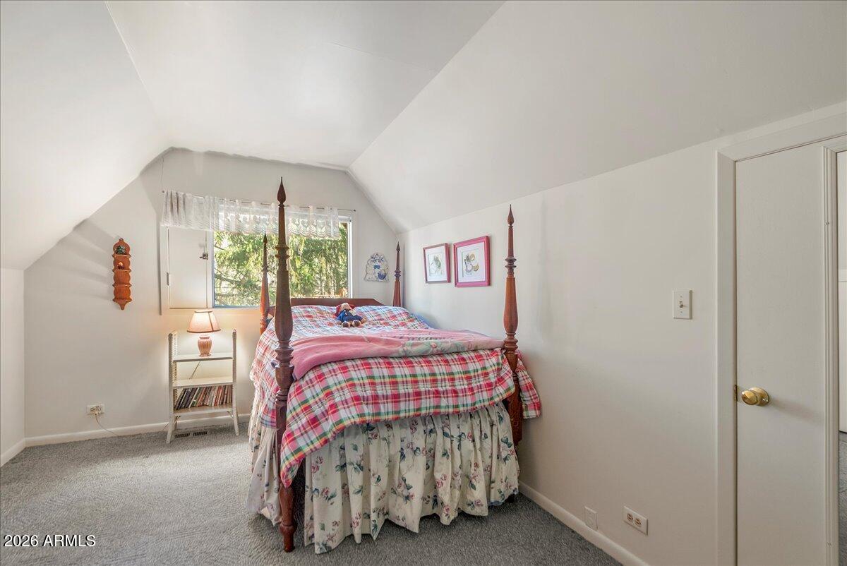 103 North Harding Drive Sedona, AZ 86336 - Photo 27 of 62 a bedroom with a bed and window