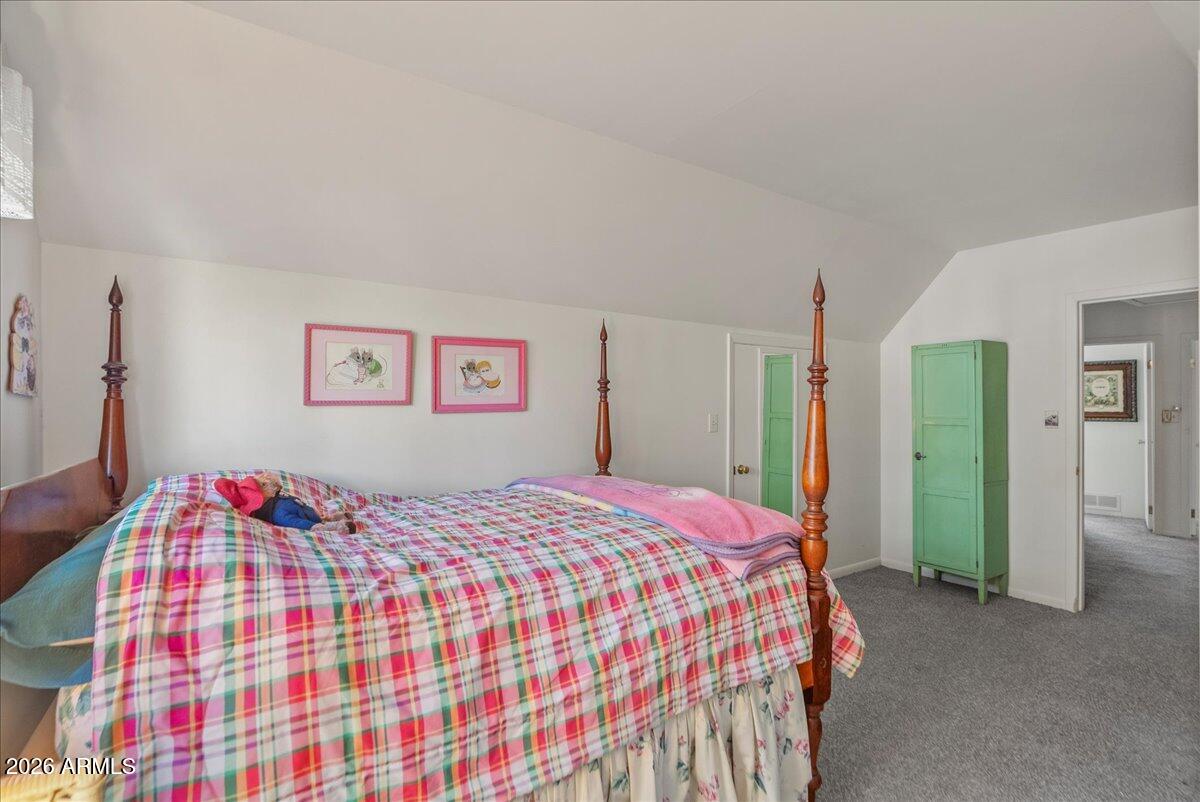 103 North Harding Drive Sedona, AZ 86336 - Photo 28 of 62 a bedroom with a bed and a painting on the wall