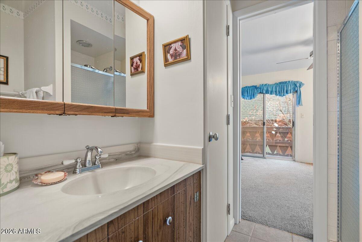 103 North Harding Drive Sedona, AZ 86336 - Photo 31 of 62 a bathroom with a sink and a mirror
