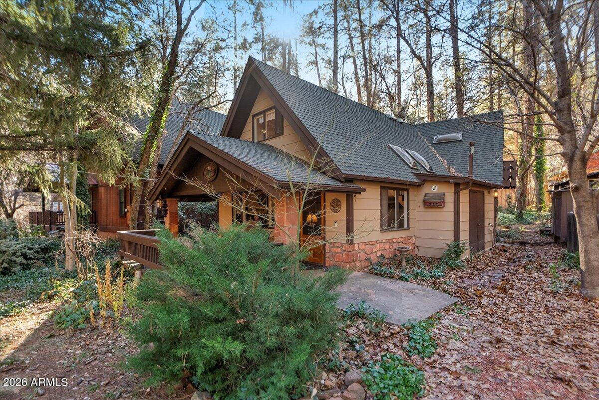 103 North Harding Drive Sedona, AZ 86336 - Photo 3 of 62 a front view of a house with a yard