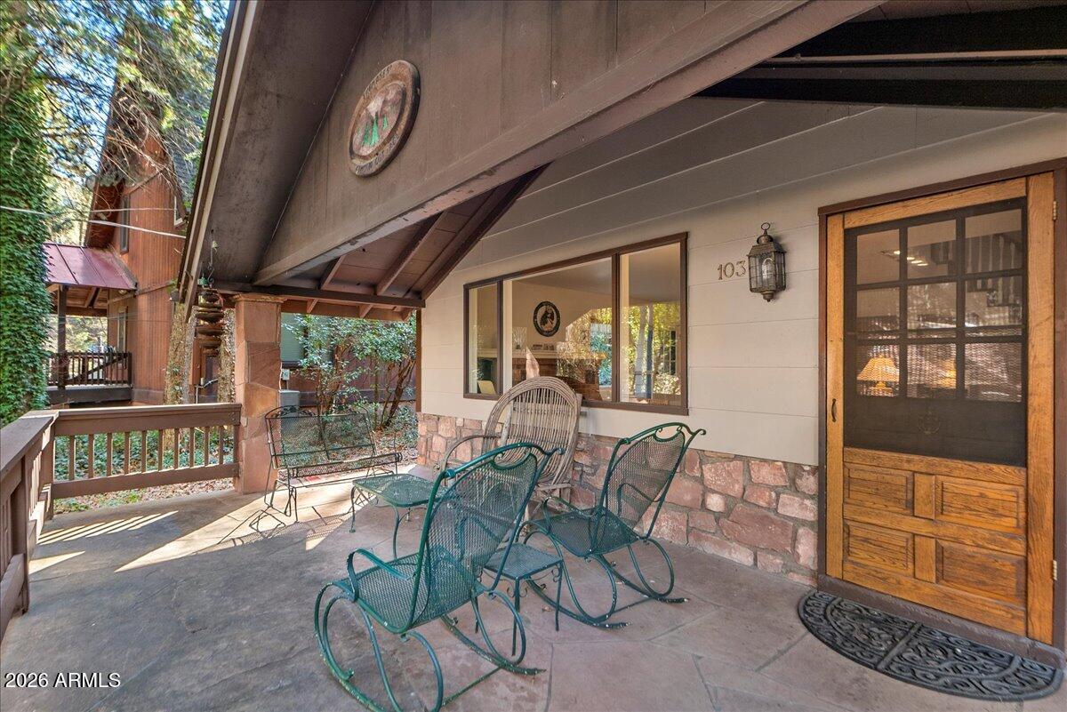 103 North Harding Drive Sedona, AZ 86336 - Photo 4 of 62 a view of a porch with furniture and floor to ceiling window