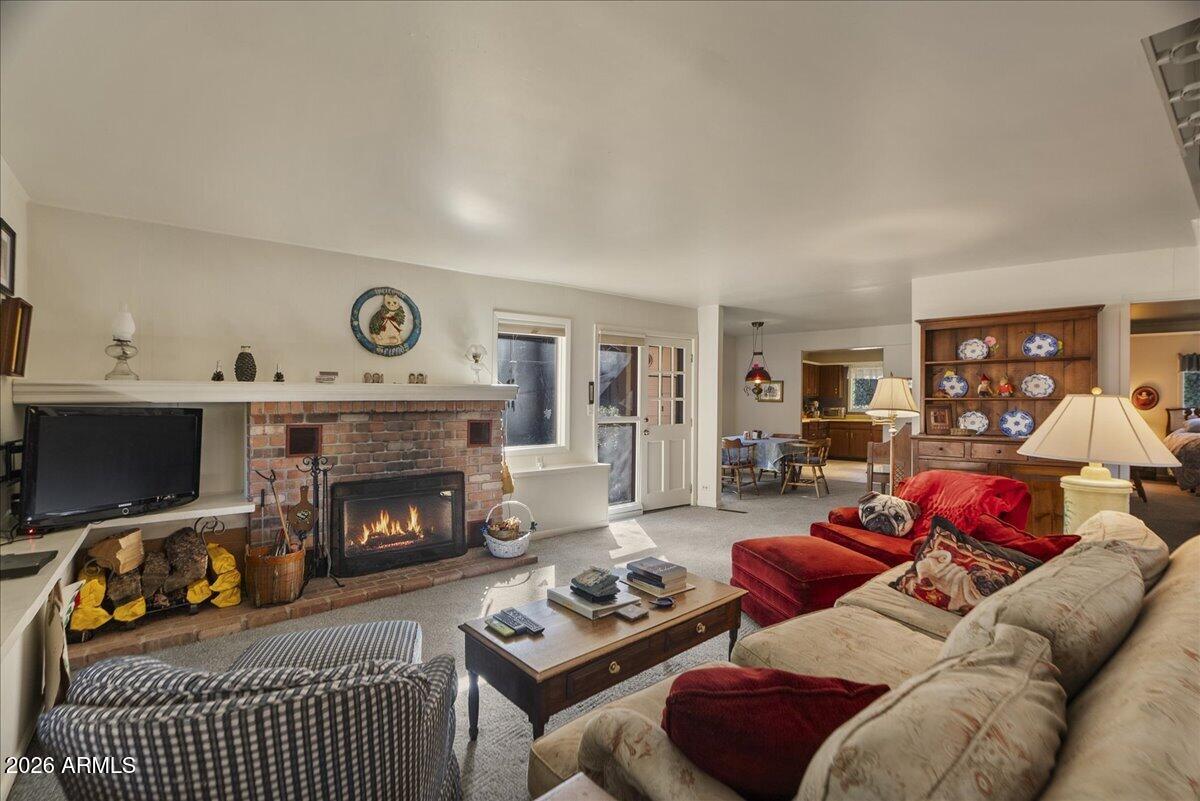 103 North Harding Drive Sedona, AZ 86336 - Photo 9 of 62 a living room with furniture and a fireplace