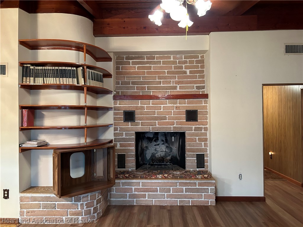 3505 Golfview Road Sebring, FL 33875 - Photo 14 of 50 a view of fireplace and a wooden floor