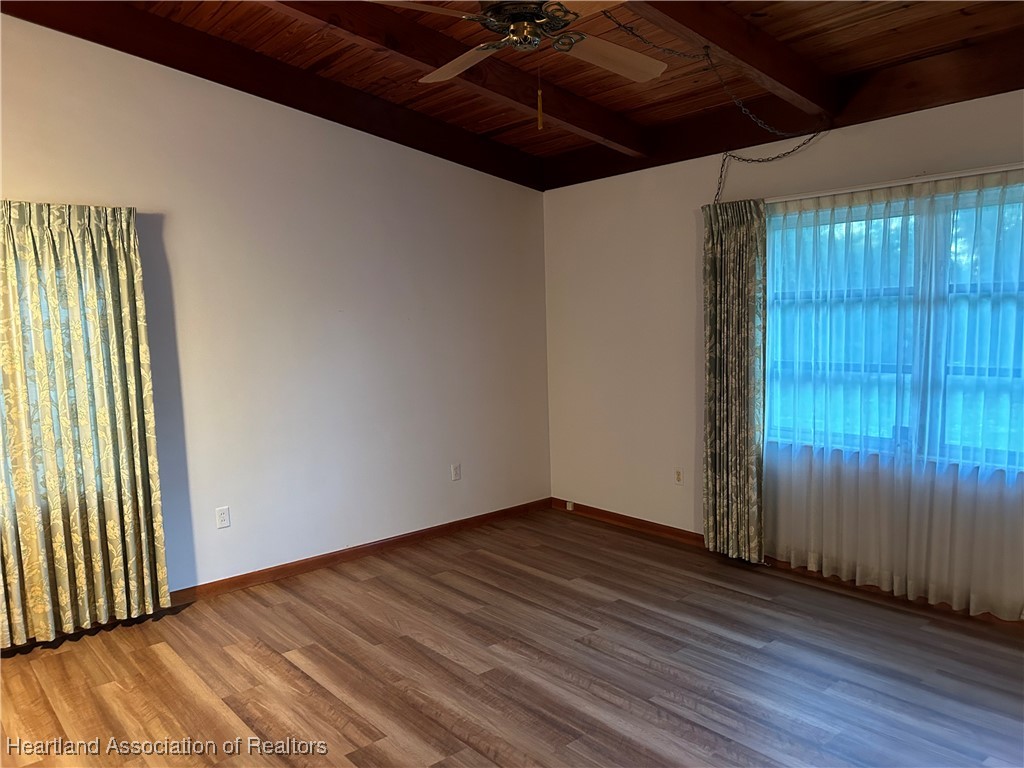 3505 Golfview Road Sebring, FL 33875 - Photo 23 of 50 an empty room with wooden floor and windows
