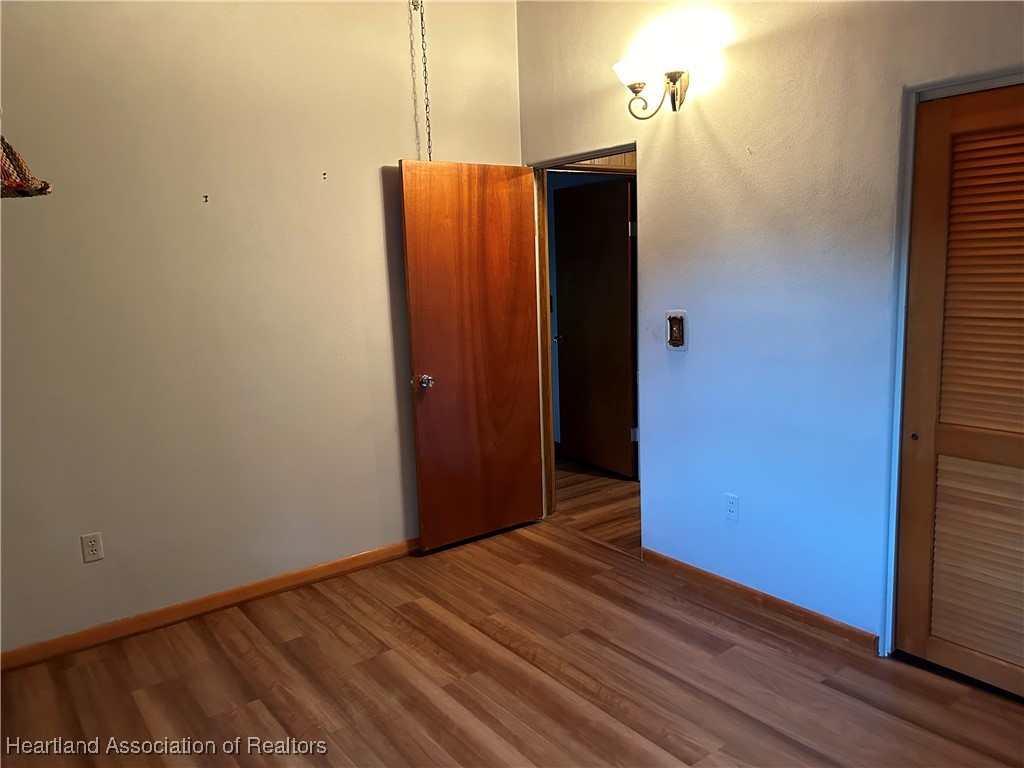 3505 Golfview Road Sebring, FL 33875 - Photo 32 of 50 a view of a hallway with wooden floor