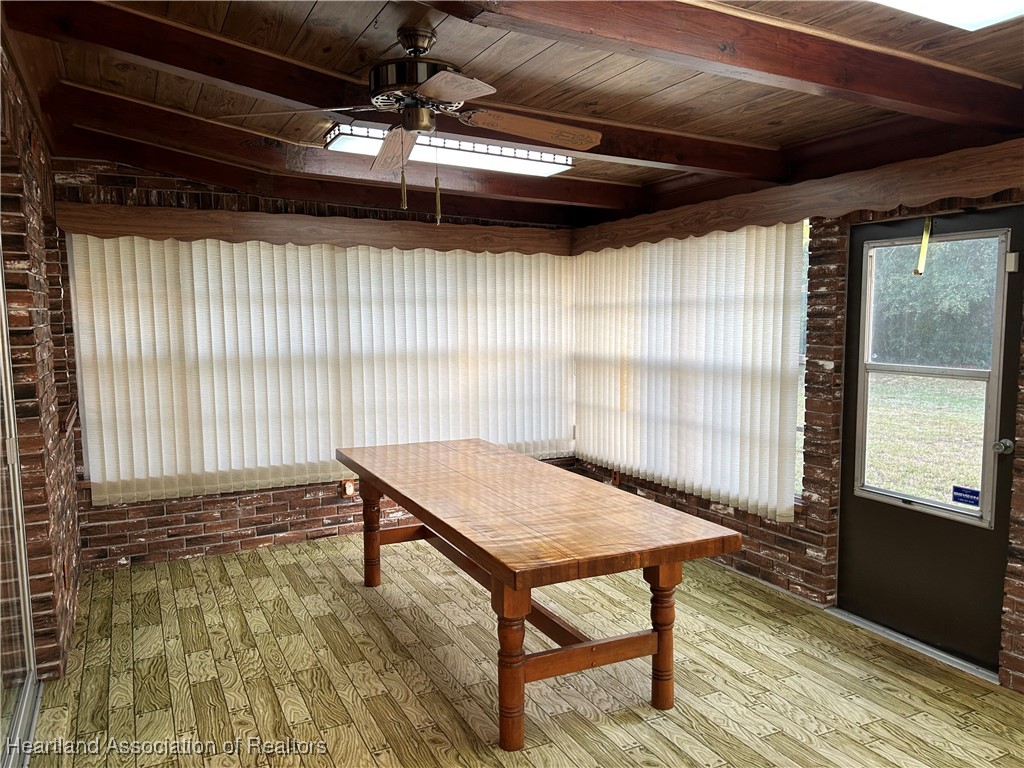 3505 Golfview Road Sebring, FL 33875 - Photo 36 of 50 a view of a room with a wooden floor and windows