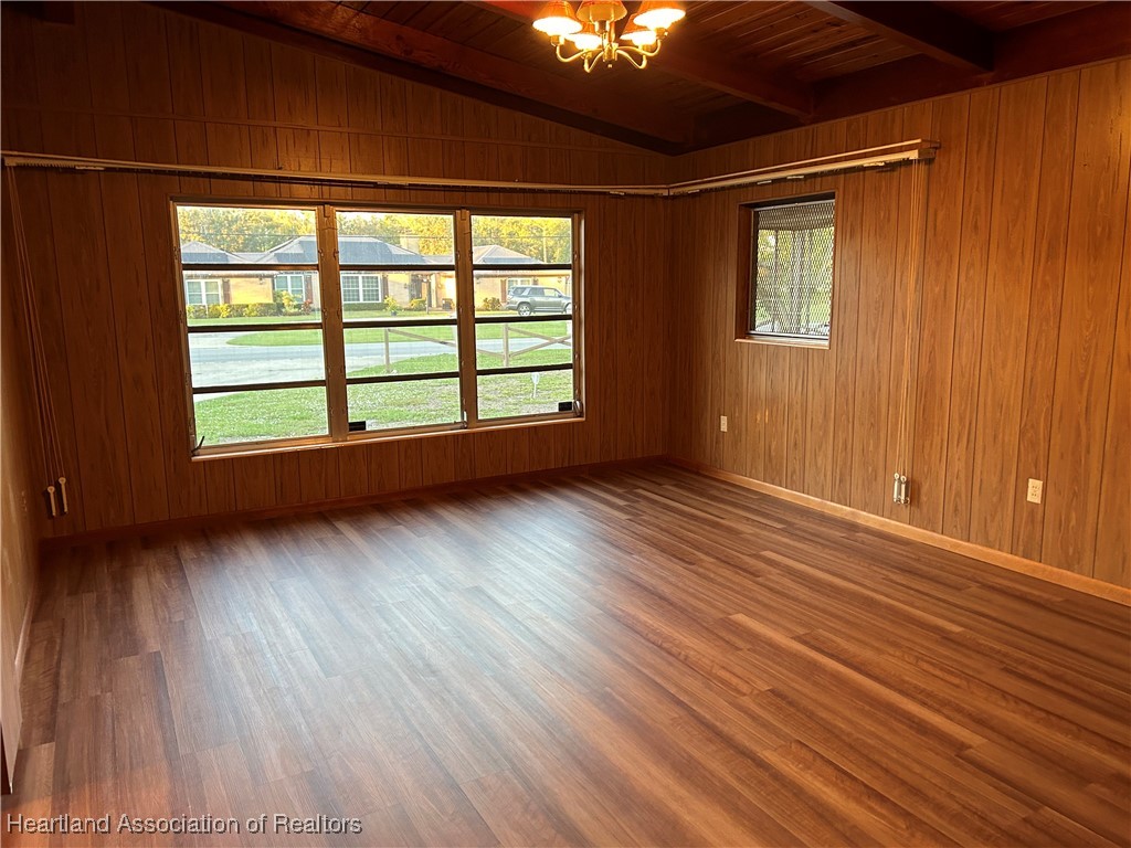 3505 Golfview Road Sebring, FL 33875 - Photo 5 of 50 a view of an empty room with wooden floor and a window