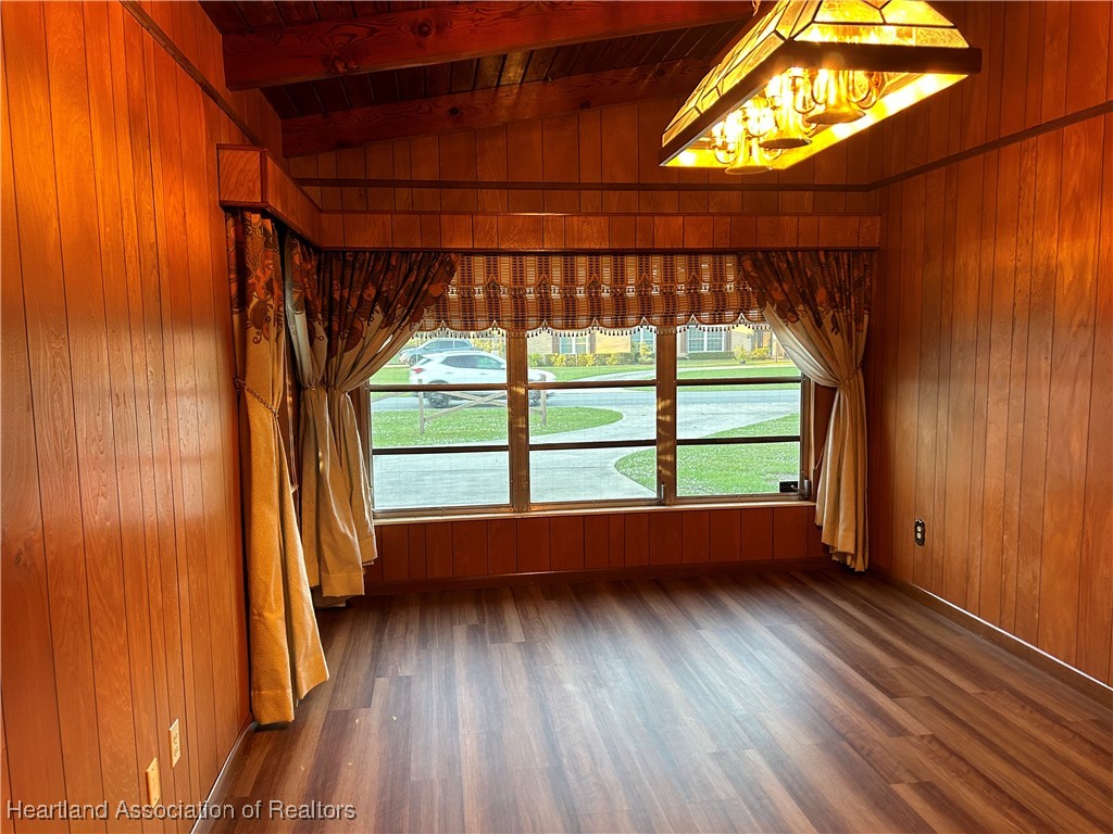 3505 Golfview Road Sebring, FL 33875 - Photo 7 of 50 an empty room with wooden floor and windows
