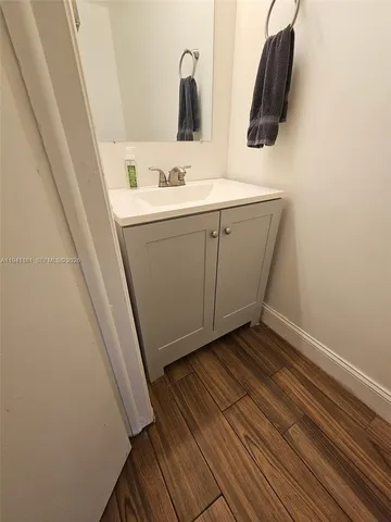 a bathroom with sink and mirror
