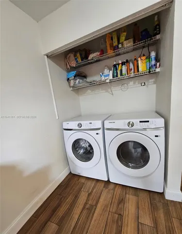 a utility room with dryer and washer