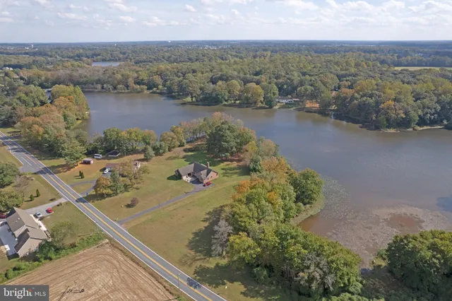 an aerial view of lake residential house with outdoor space