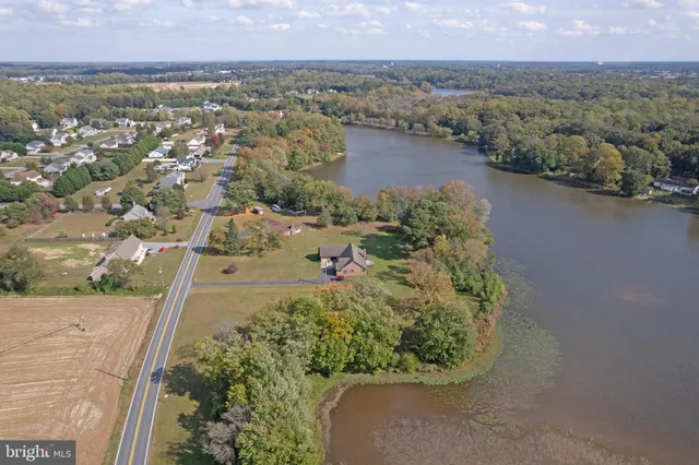 an aerial view of a house with a lake view