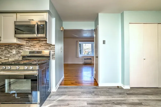 a view of a kitchen cabinets and stainless steel appliances