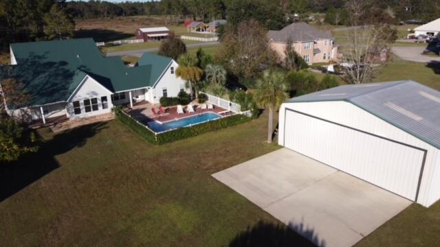 1510 Vinson Ray Road Baker, FL 32531 - Photo 48 of 60 an aerial view of a house with a yard basket ball court and outdoor seating