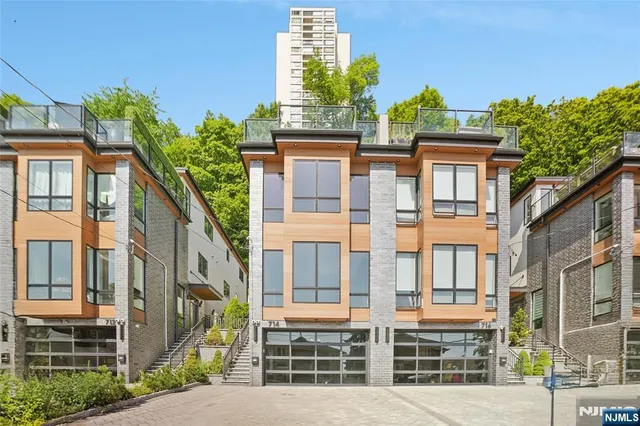 a view of empty room with wooden floor and floor to ceiling window