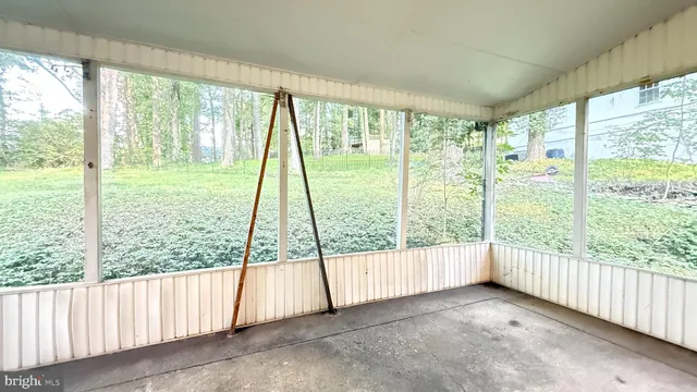 a view of a kitchen with wooden floor and a sink