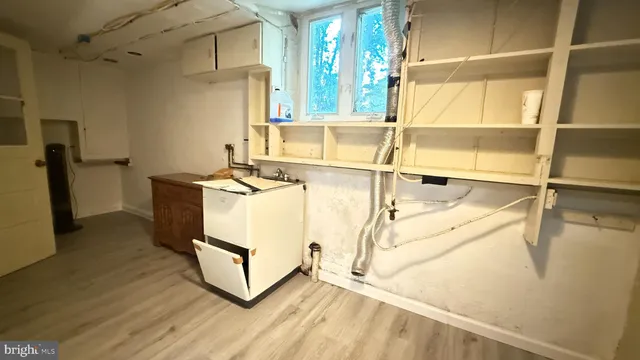 a white toilet sitting next to a bathroom sink