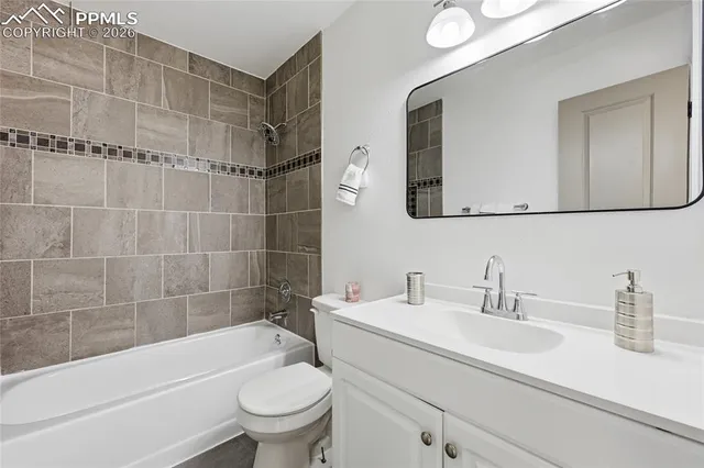 a bathroom with a sink a toilet and a bathtub