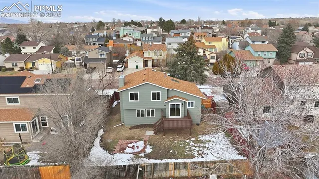 a aerial view of a house with a yard