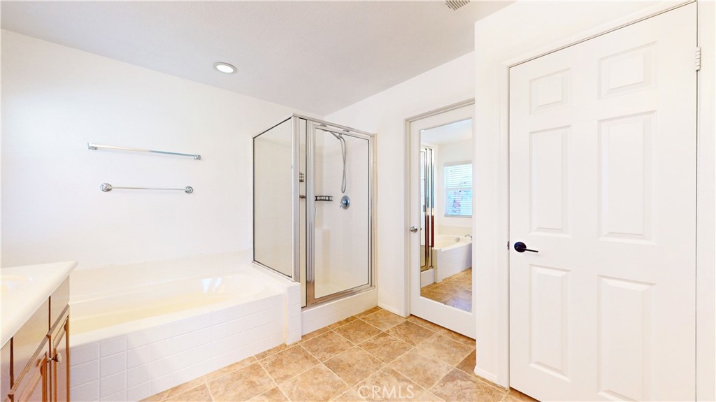 1279 Longbranch Road San Jacinto, CA 92582 - Photo 17 of 35 a bathroom with a bathtub and a shower