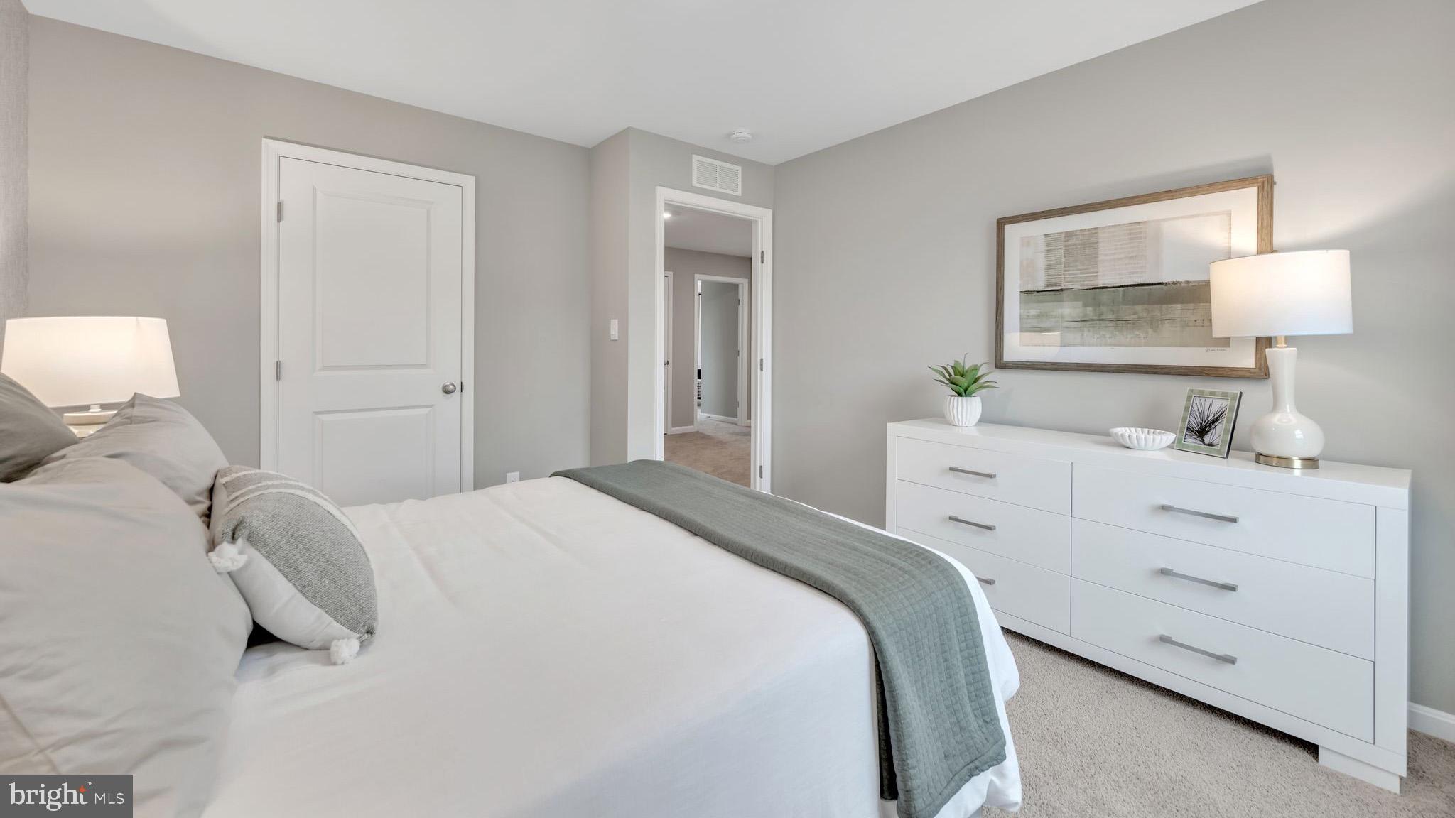 2038 Paperback Way York, PA 17408 - Photo 20 of 29 a bedroom with a bed and a night stand