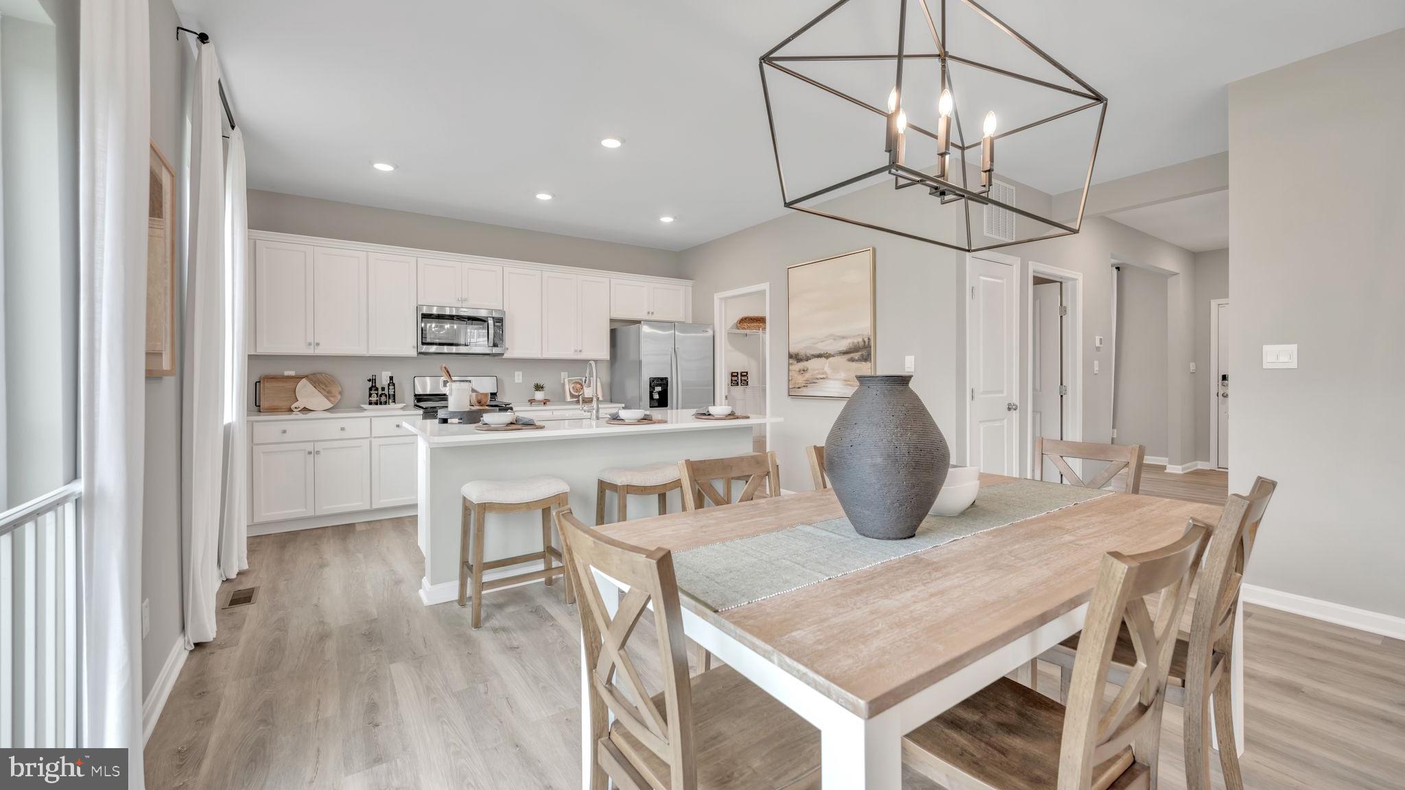 2038 Paperback Way York, PA 17408 - Photo 8 of 29 a kitchen with kitchen island a white table and chairs in it