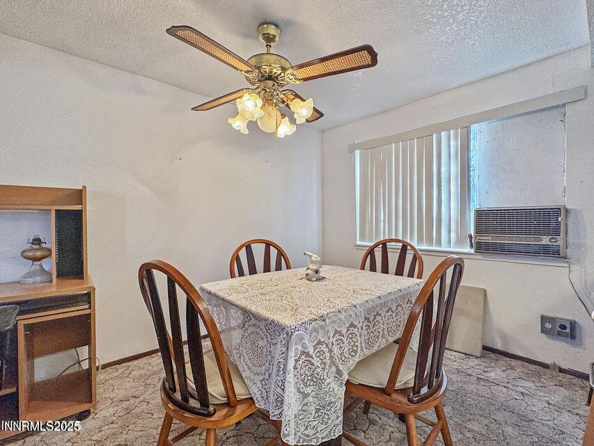40 Basque Road Orovada, NV 89425 - Photo 7 of 16 a view of a dining room with furniture and a chandelier