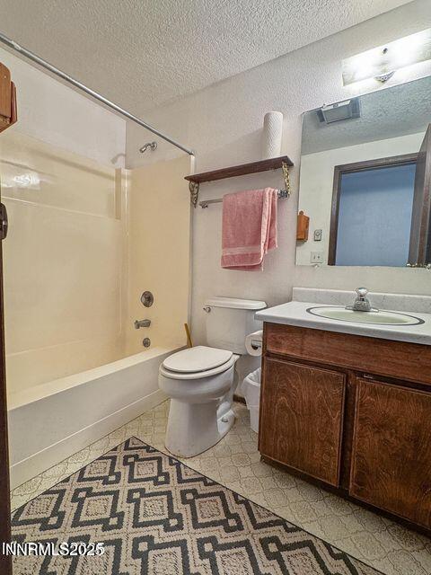 40 Basque Road Orovada, NV 89425 - Photo 9 of 16 a bathroom with a toilet sink and mirror