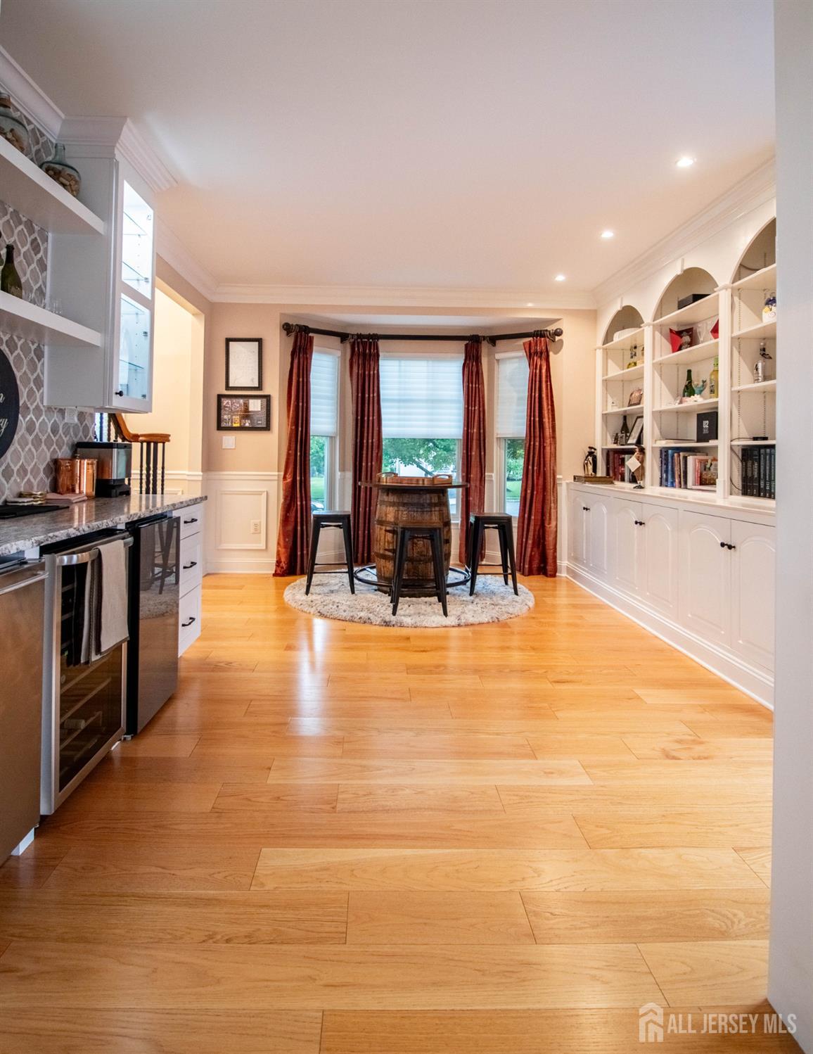 9 Pondview Drive Tinton Falls, NJ 07724 - Photo 29 of 41 a living room with furniture and large windows