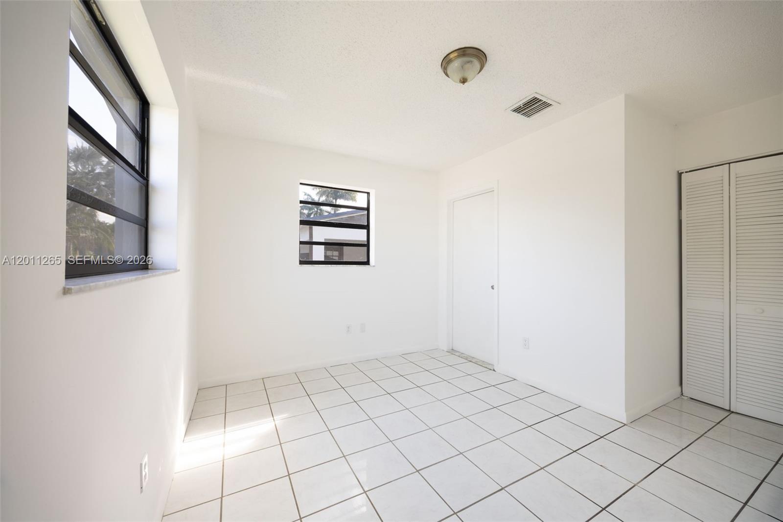 29935 Southwest 143rd Court Homestead, FL 33033 - Photo 13 of 25 a view of an empty room
