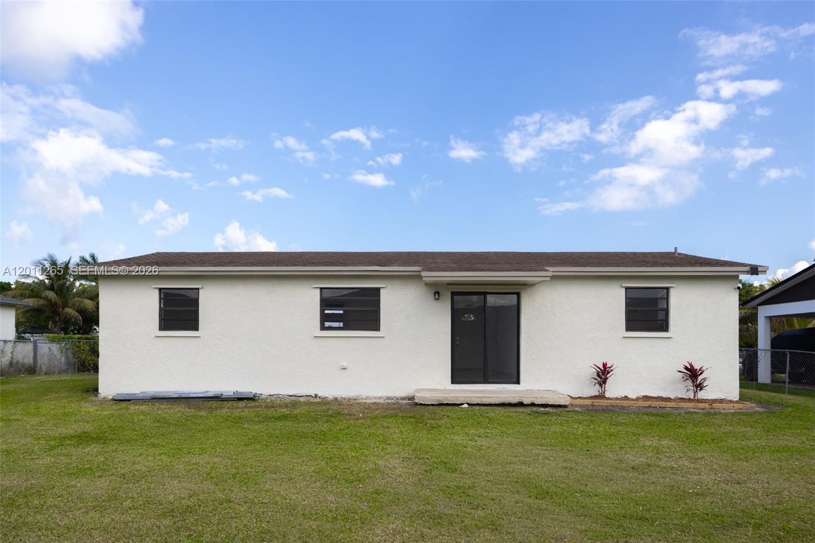 29935 Southwest 143rd Court Homestead, FL 33033 - Photo 24 of 25 a front view of house with yard