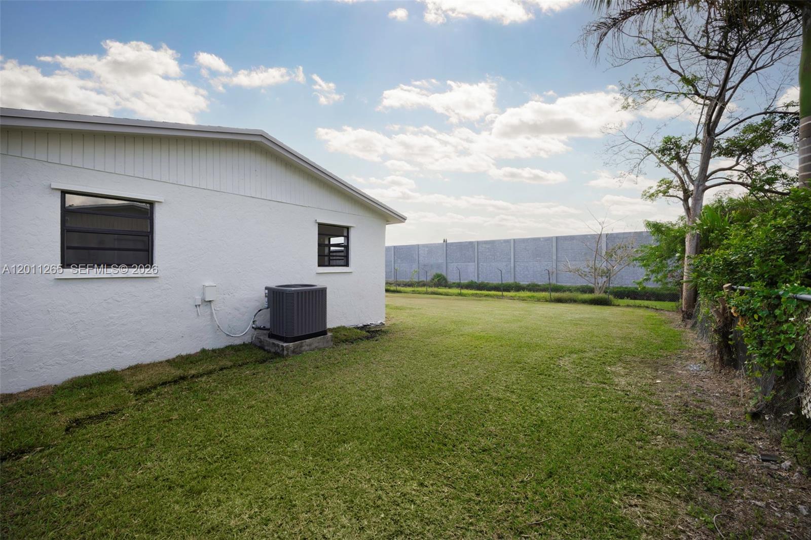 29935 Southwest 143rd Court Homestead, FL 33033 - Photo 25 of 25 a house view with a garden space