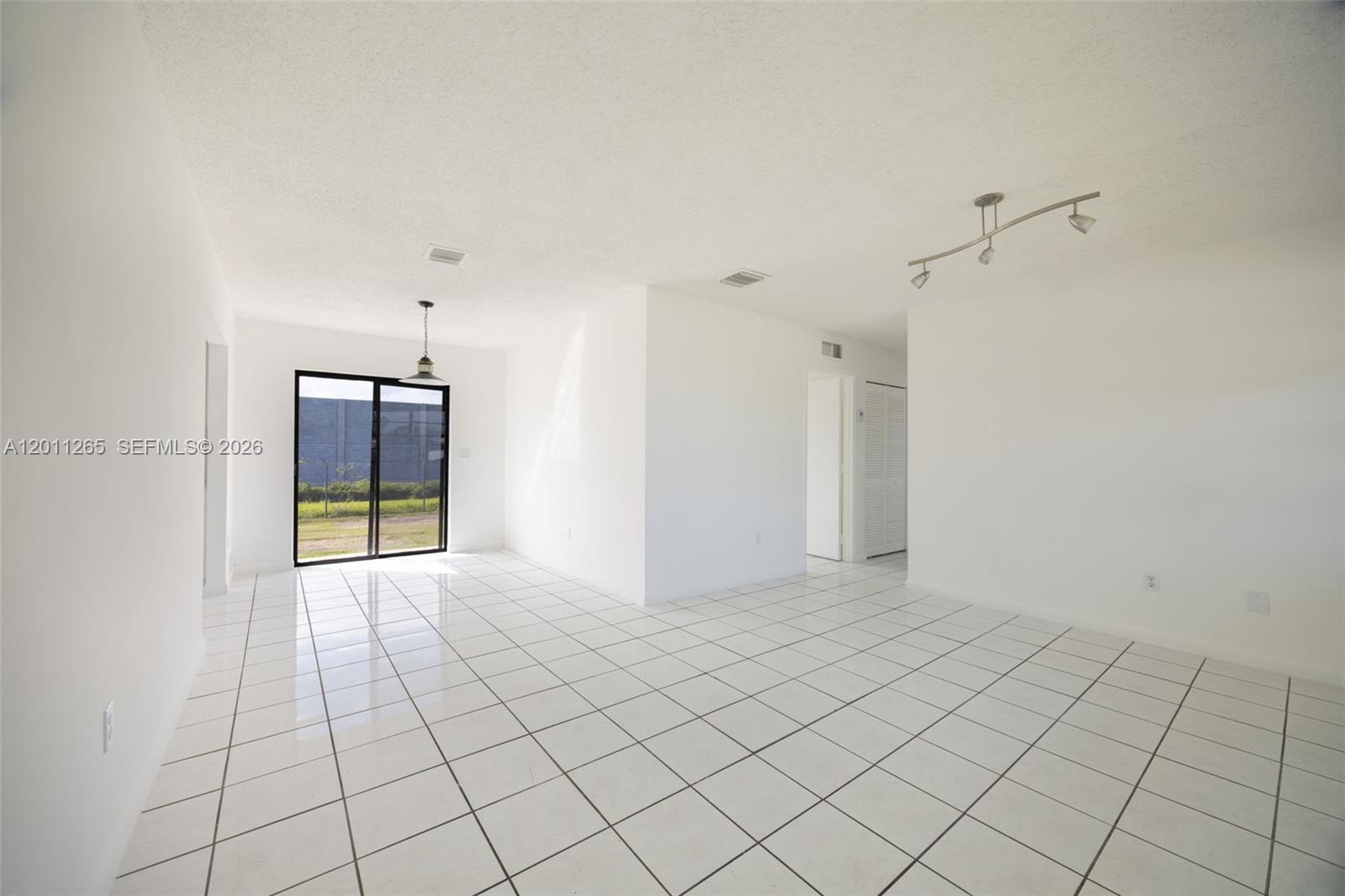 29935 Southwest 143rd Court Homestead, FL 33033 - Photo 6 of 25 a view of an empty room