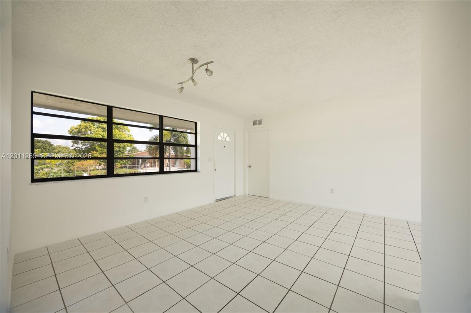 29935 Southwest 143rd Court Homestead, FL 33033 - Photo 7 of 25 a view of an empty room
