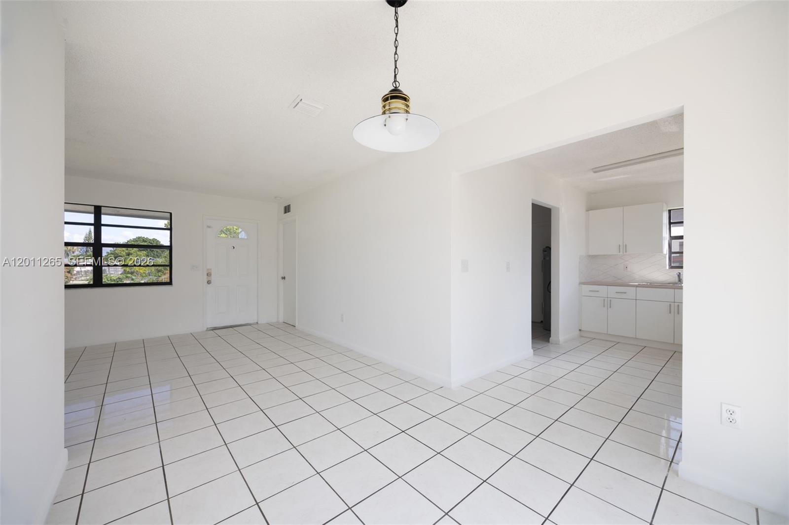 29935 Southwest 143rd Court Homestead, FL 33033 - Photo 8 of 25 a view of an empty room and window