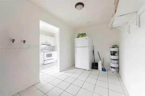 a kitchen with cabinets appliances and a sink