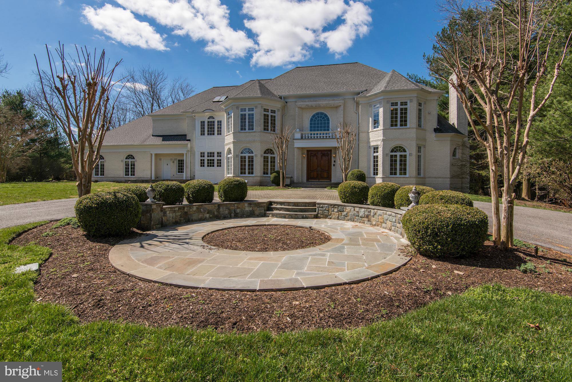 11112 Potomac View Drive Potomac, MD 20854 - Photo 1 of 30 a view of a white house with a sink and a yard