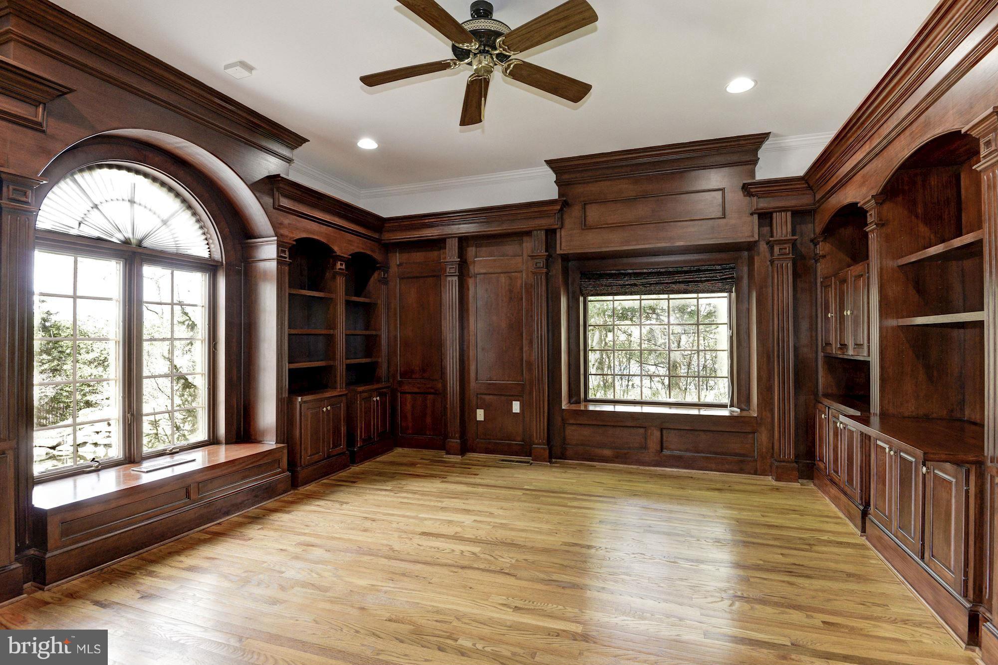 11112 Potomac View Drive Potomac, MD 20854 - Photo 12 of 30 a view of empty room with wooden floor and fan