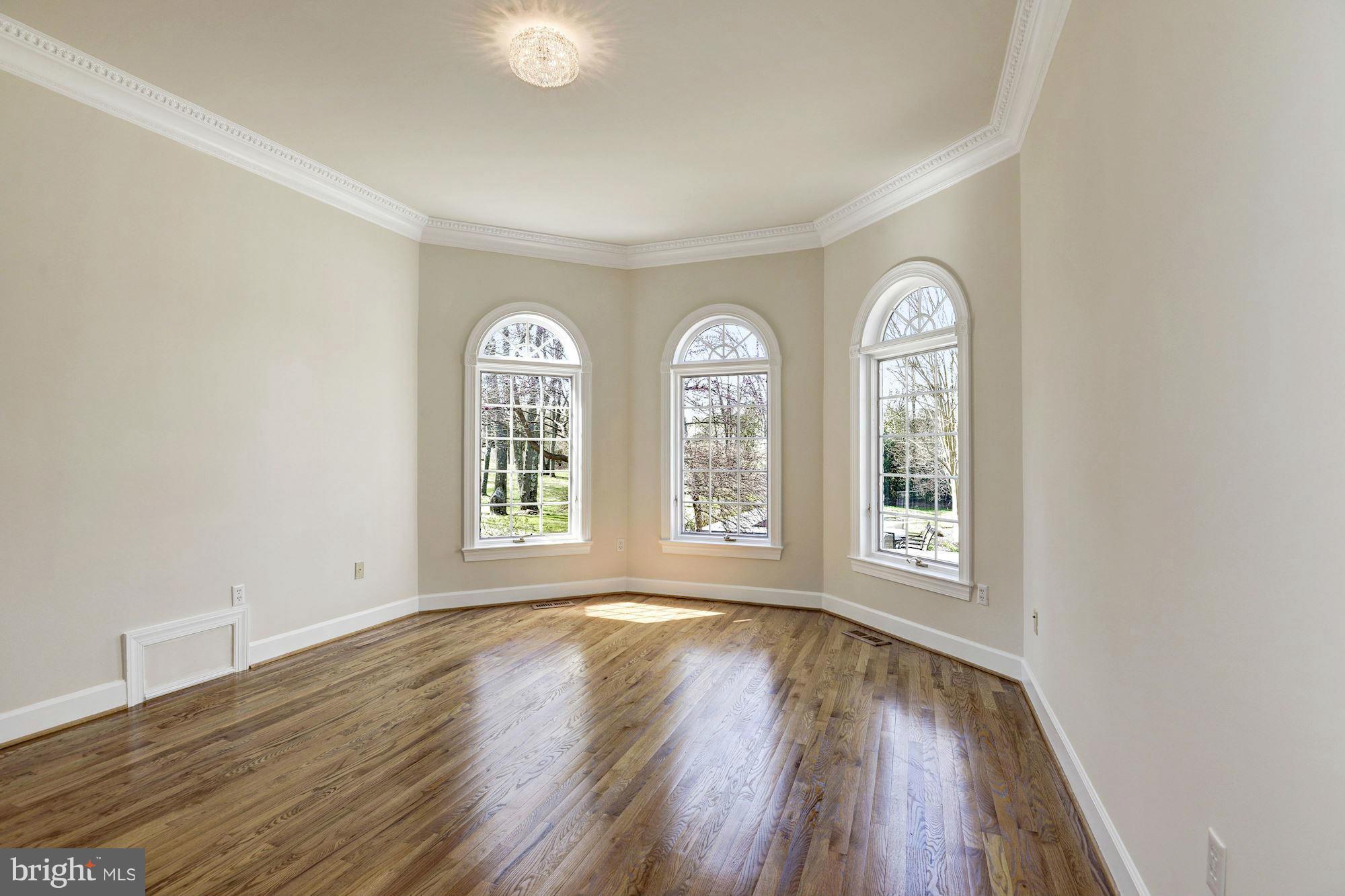 11112 Potomac View Drive Potomac, MD 20854 - Photo 13 of 30 a view of empty room with wooden floor and fan