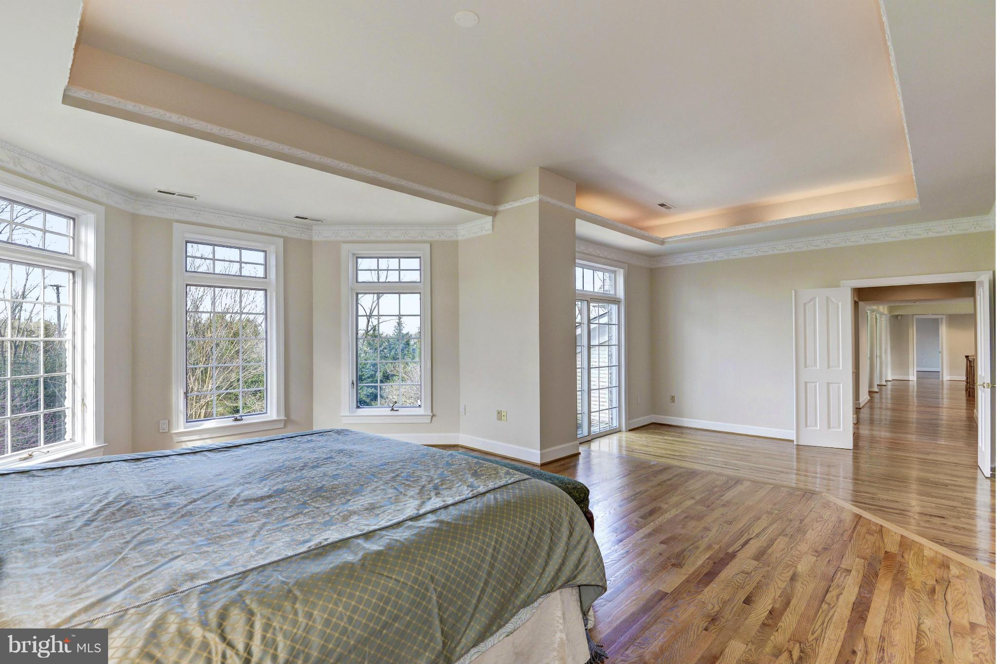 11112 Potomac View Drive Potomac, MD 20854 - Photo 15 of 30 a spacious bedroom with a balcony and wooden floor
